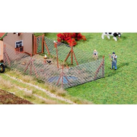 Wire mesh fence with wood poles 